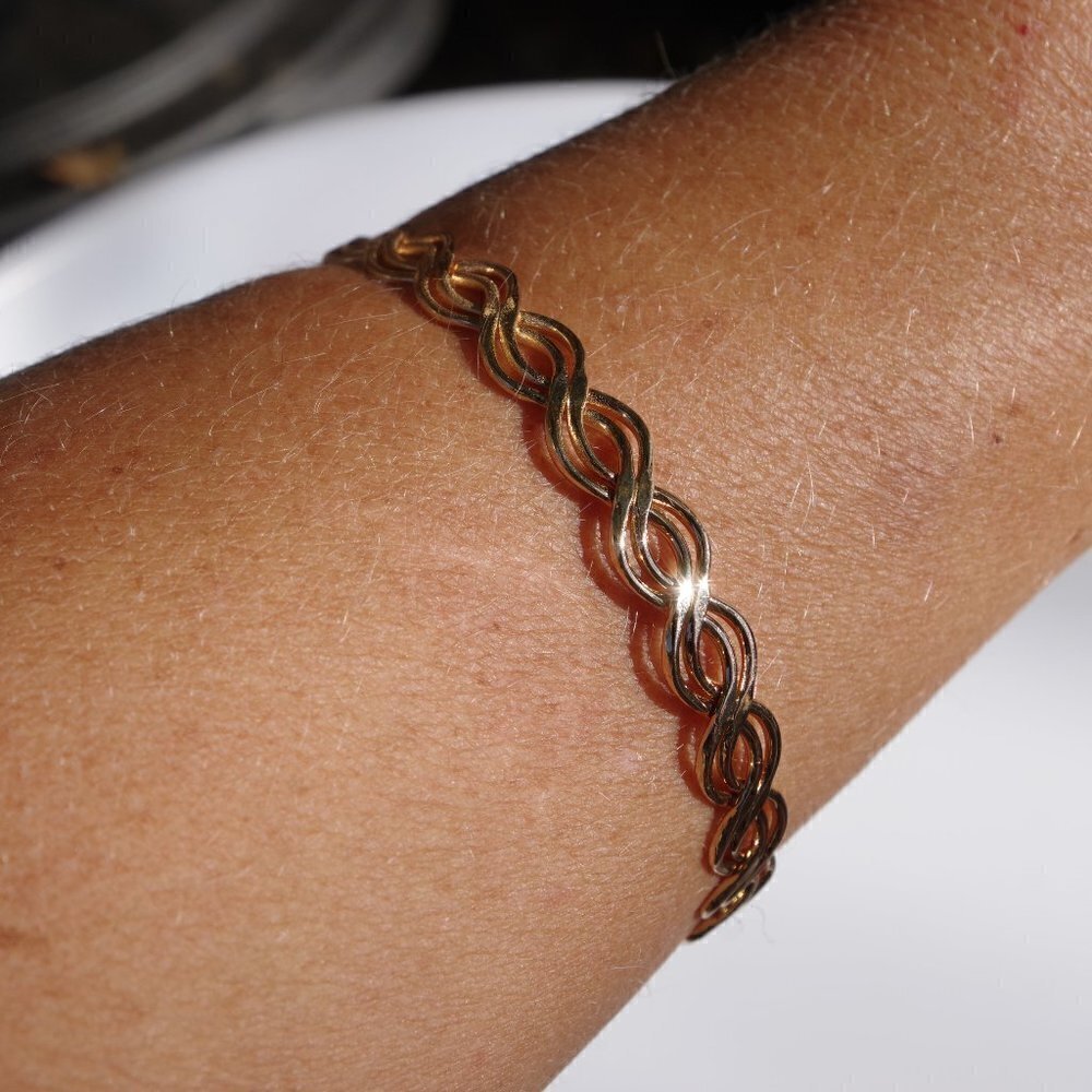 Women`s gold tone bangle bracelet.